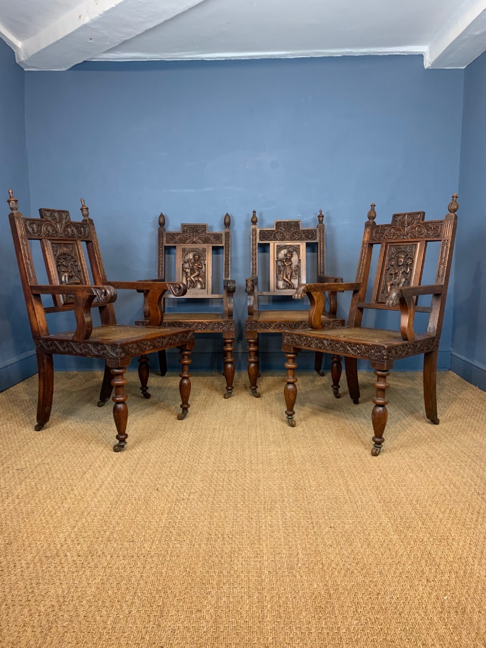 A rare set of four Indian carved teakwood throne chairs. Bombay presidency circa 1880