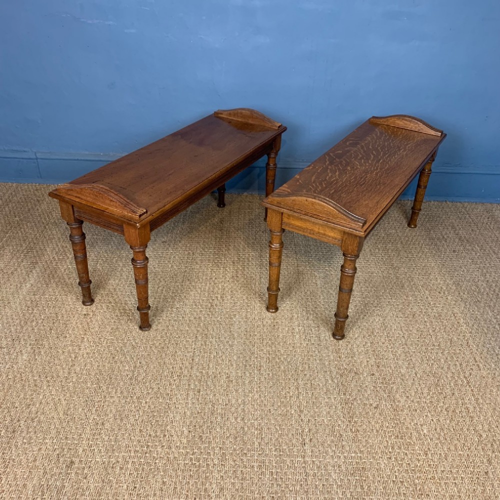 A pair of Aesthetic Movement oak and walnut hall benches 