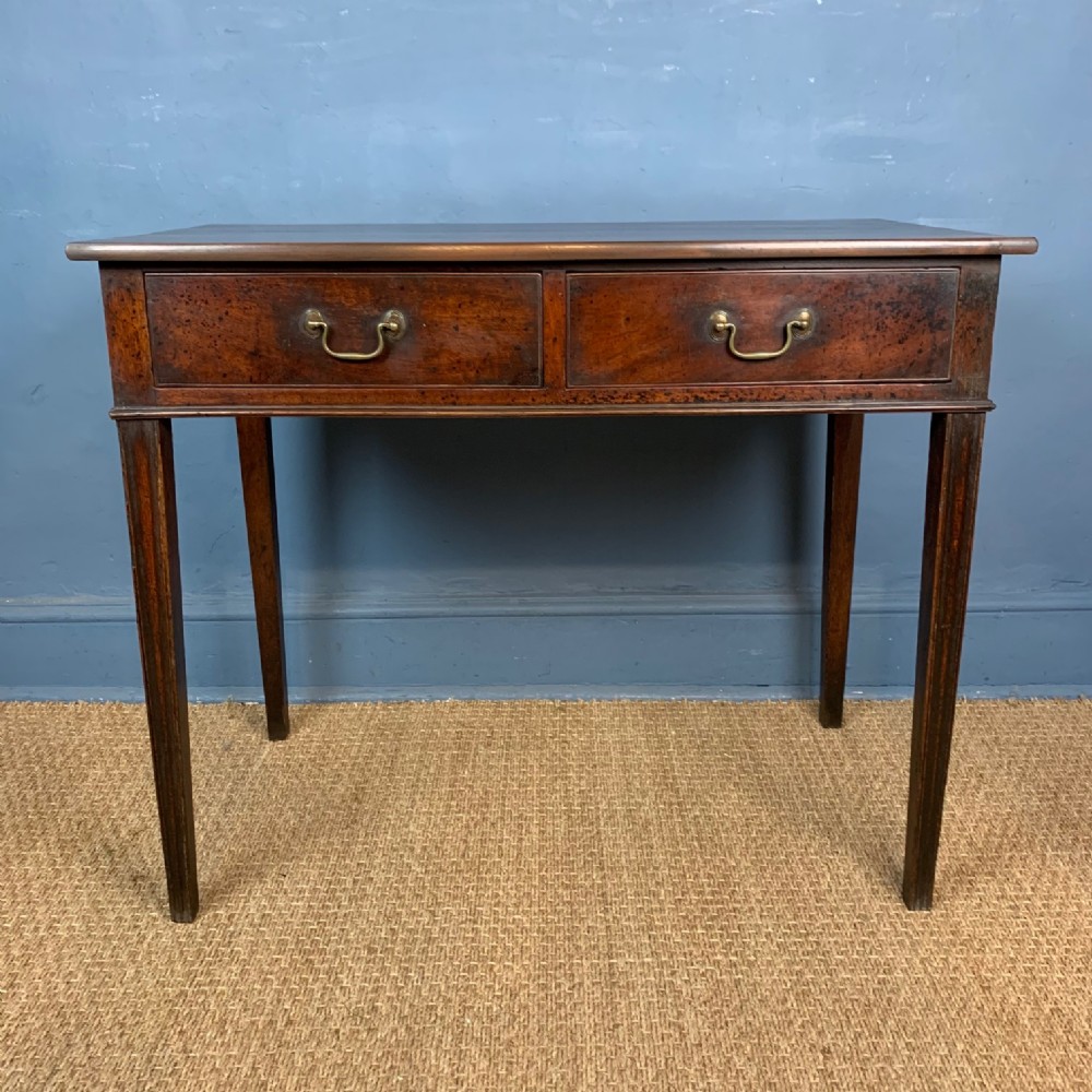 A George III mahogany two-drawered side table circa 1780