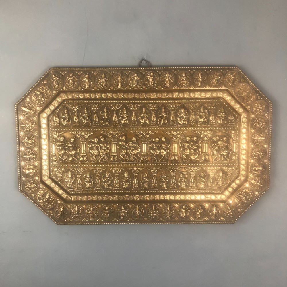 A fine quality southern Indian cast brass and silver inlaid tray depicting scenes of Hindu deities, circa 1890
