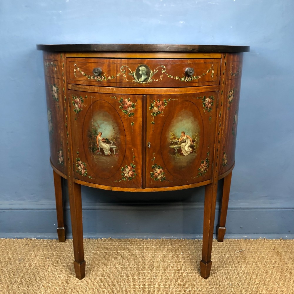 A late Victorian satinwood and painted demi lune commode circa 1890