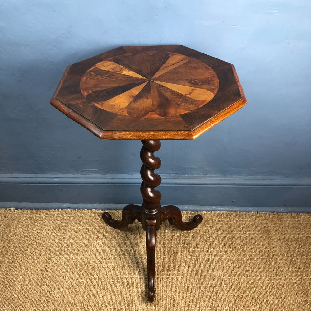 A mid 19th C oak and specimen wood tripod table circa 1860