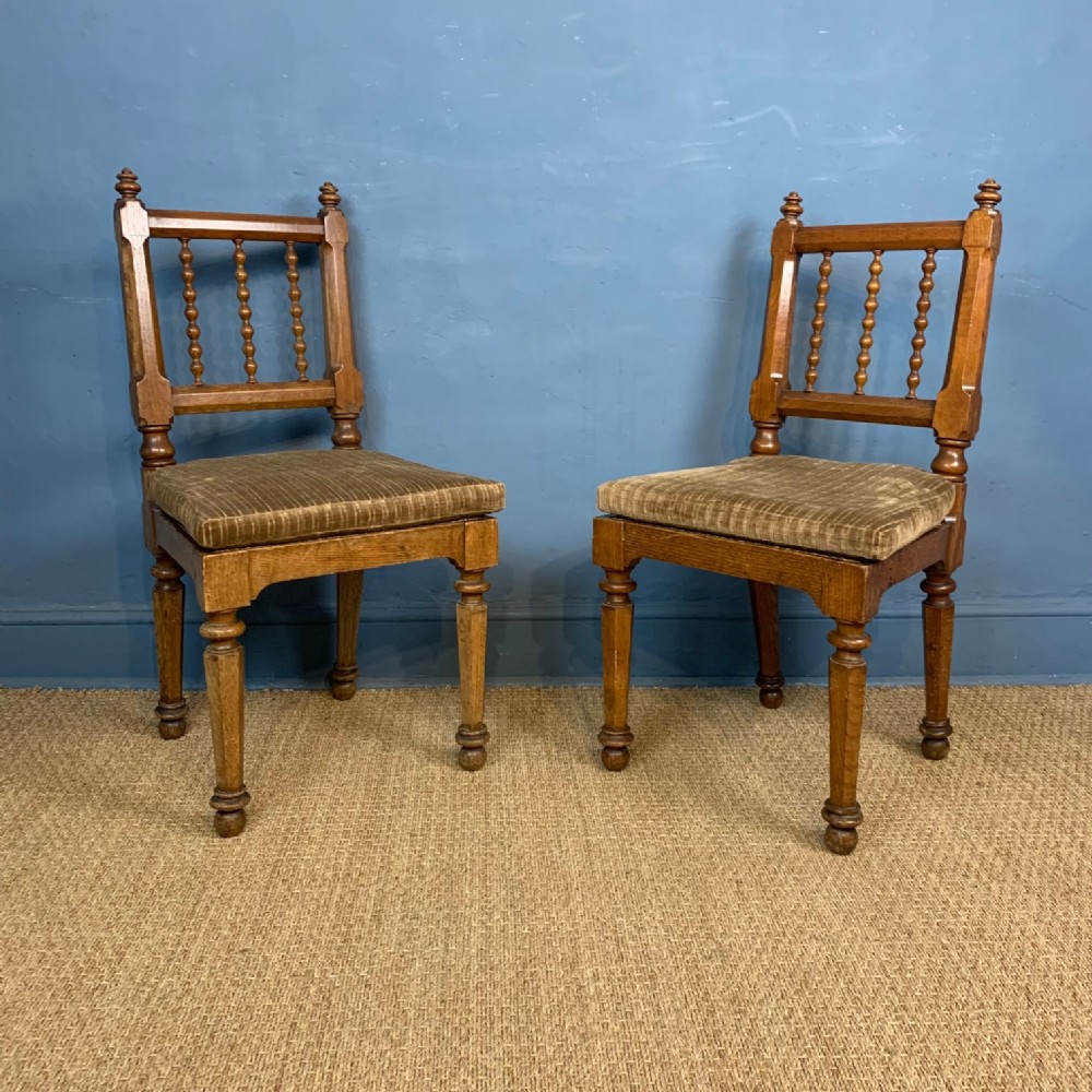 A pair of Scottish Oak Bobbin turned and cane seated hall chairs circa 1870