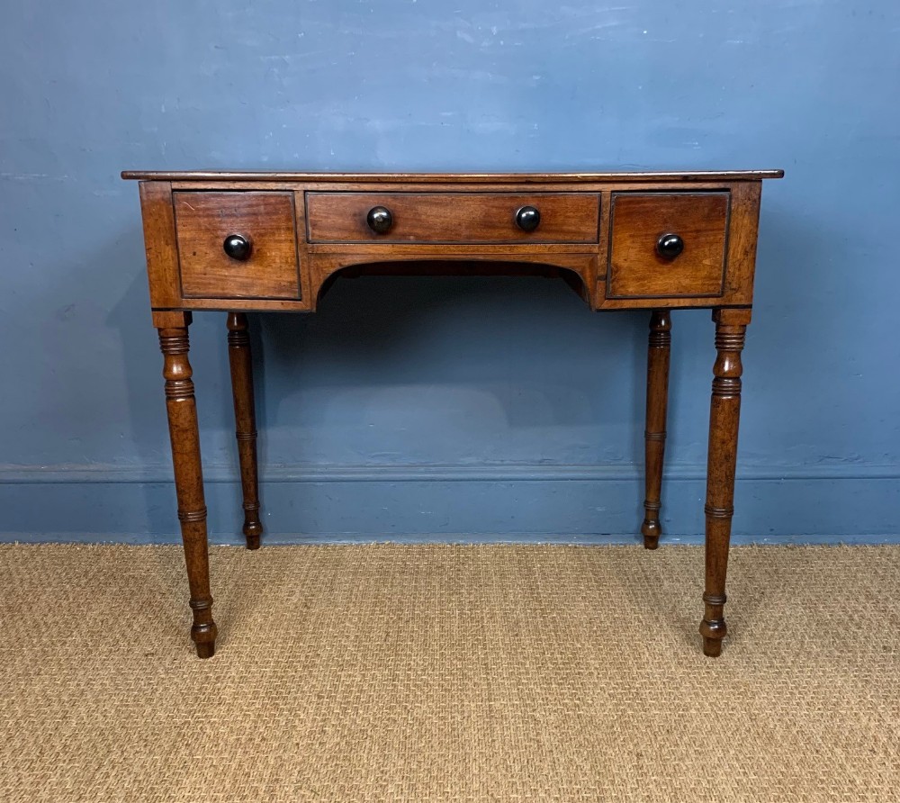 A George IV mahogany and ebony strung side or dressing table circa 1830