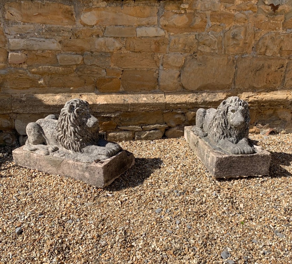 A pair of composite stone lions circa 1930