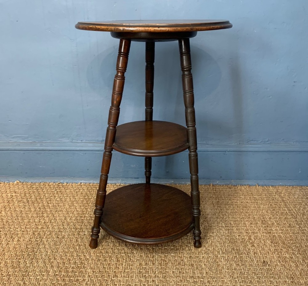 An Aesthetic Movement mahogany three-tier circular table c 1880