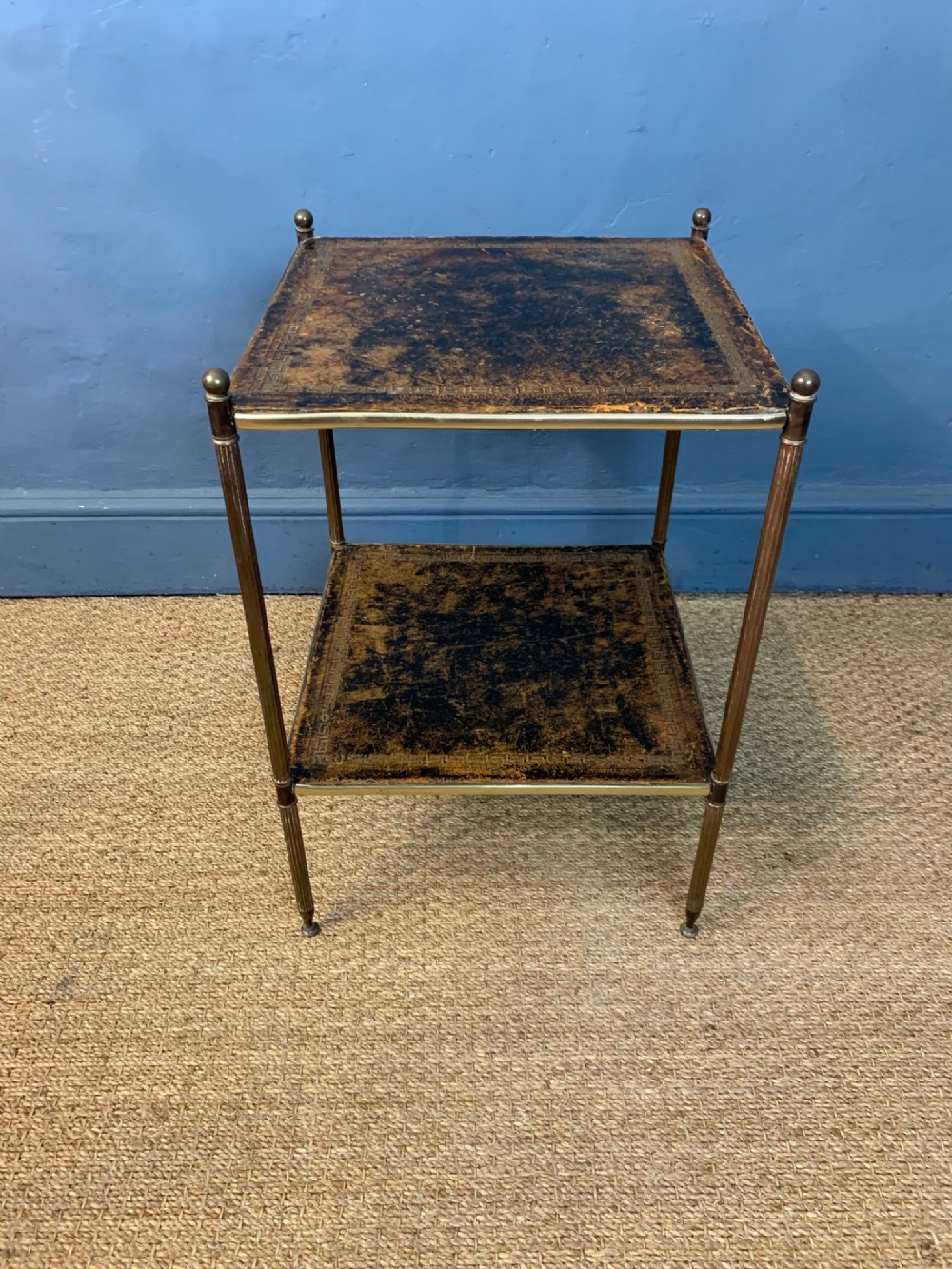 A 1930's brass iron and leather 2 tier trolley.
