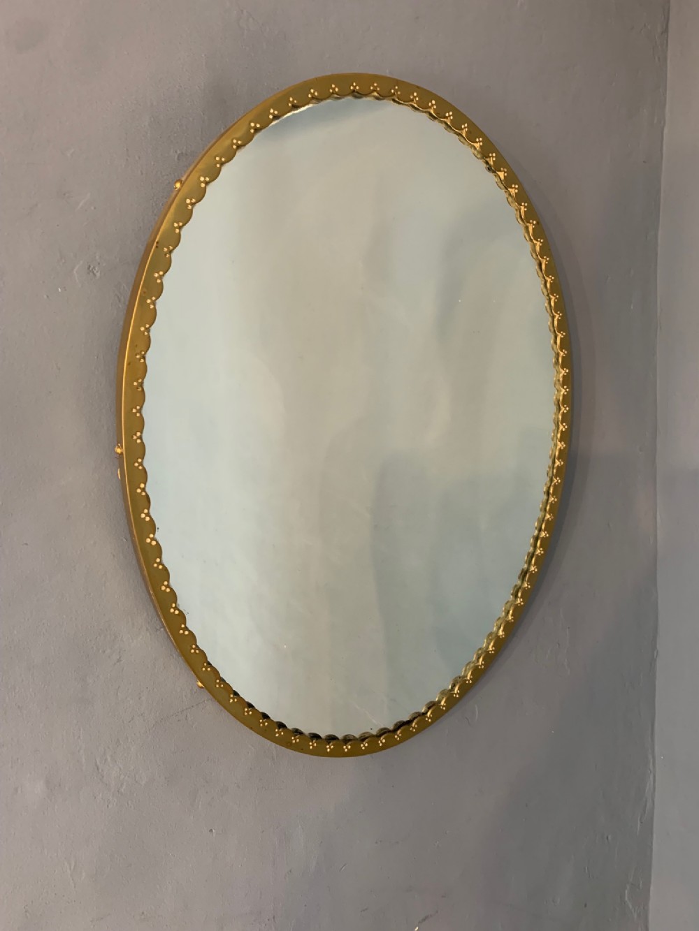  An unusual Edwardian brass oval mirror circa 1910