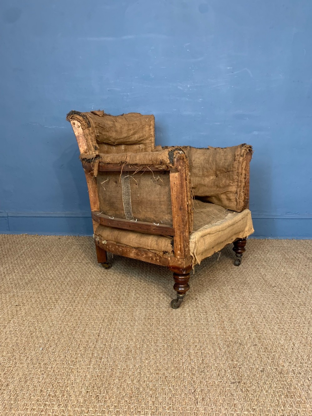 A late Victorian Howard style Woodstock armchair c 1900