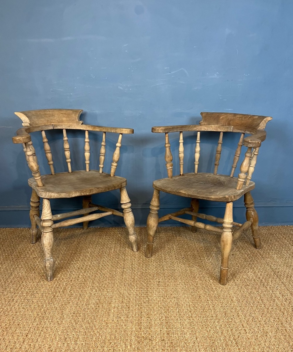 A pair of late 19th c bleached elm and beech smokers bow armchairs 
