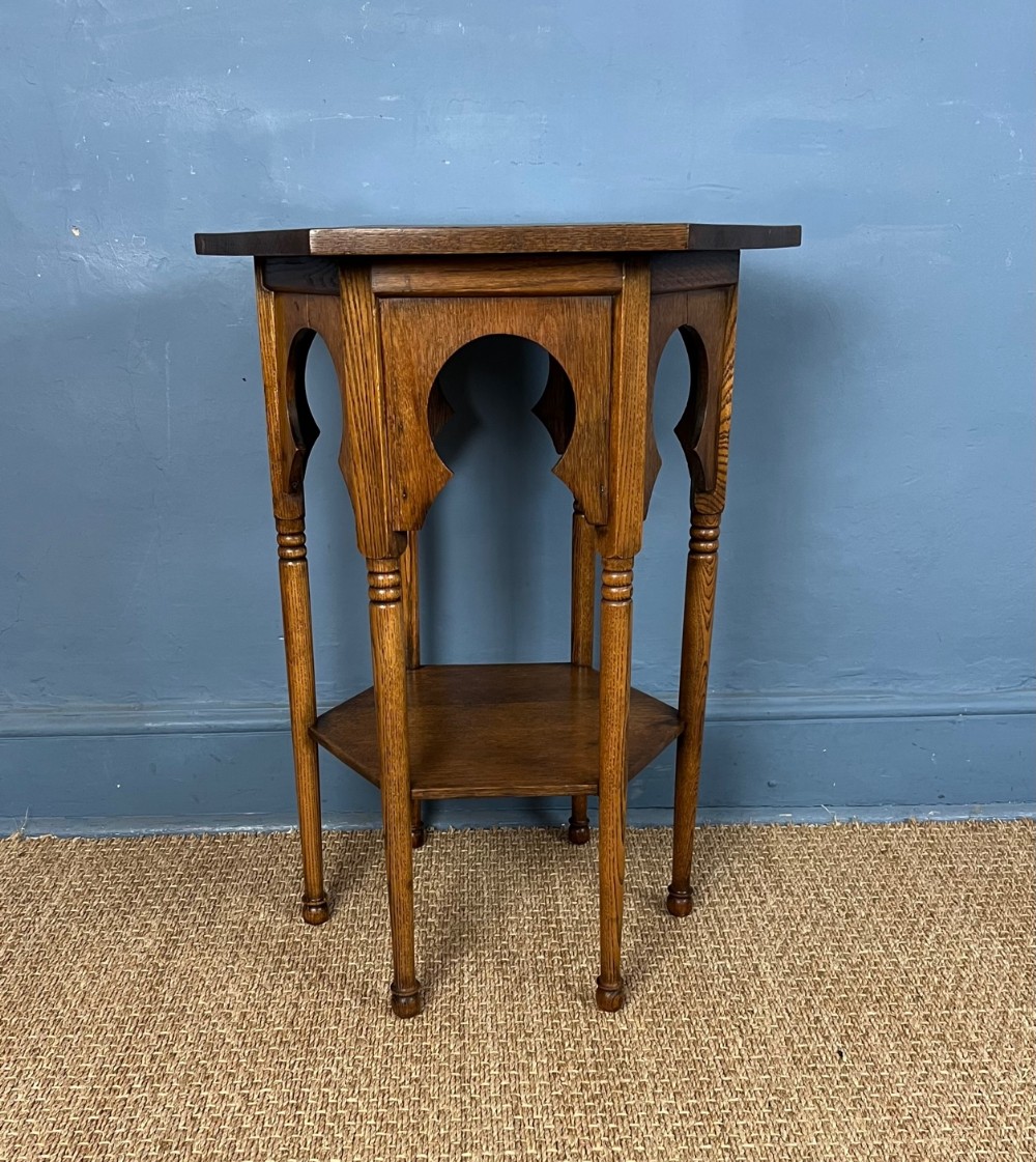 A Liberty and Co oak Moorish hexagonal 2 tier table circa 1900