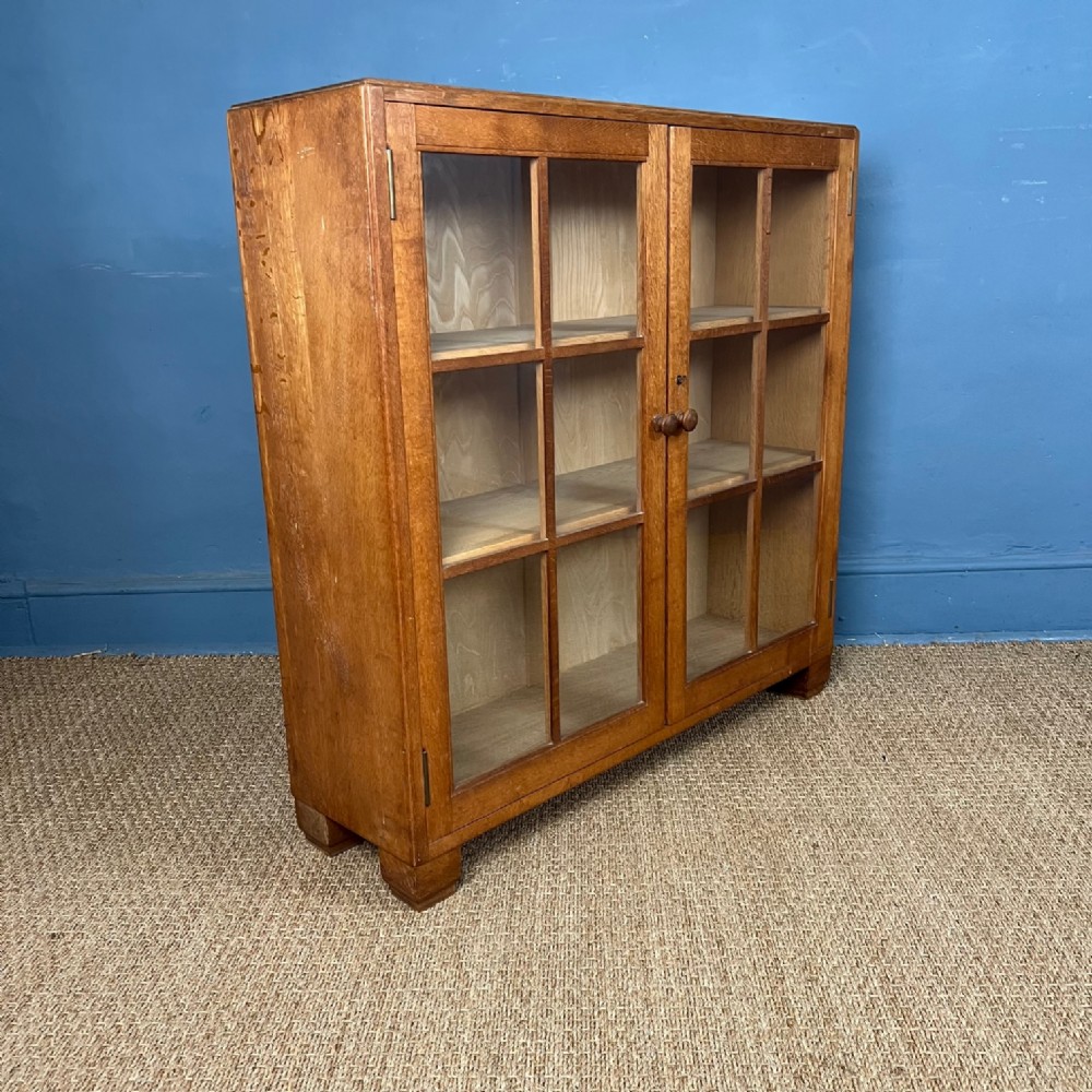 A Heals oak glazed bookcase circa 1930 