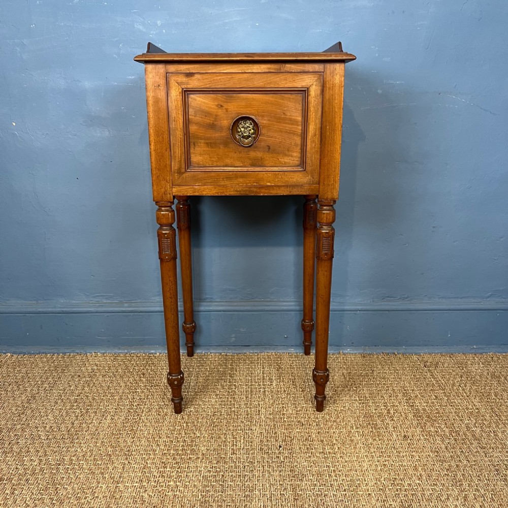 A George IV mahogany bedside table circa 1830