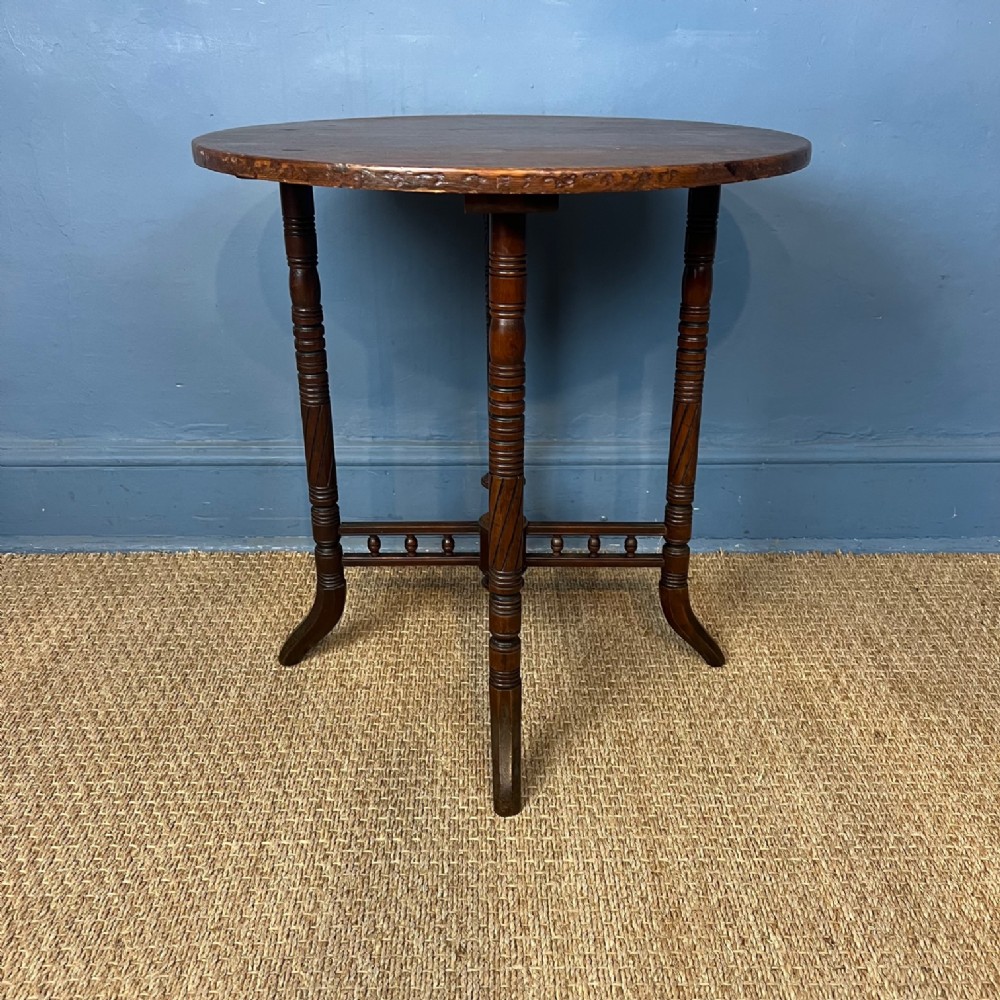 An Aesthetic Movement Beech and walnut circular table circa 1890 .