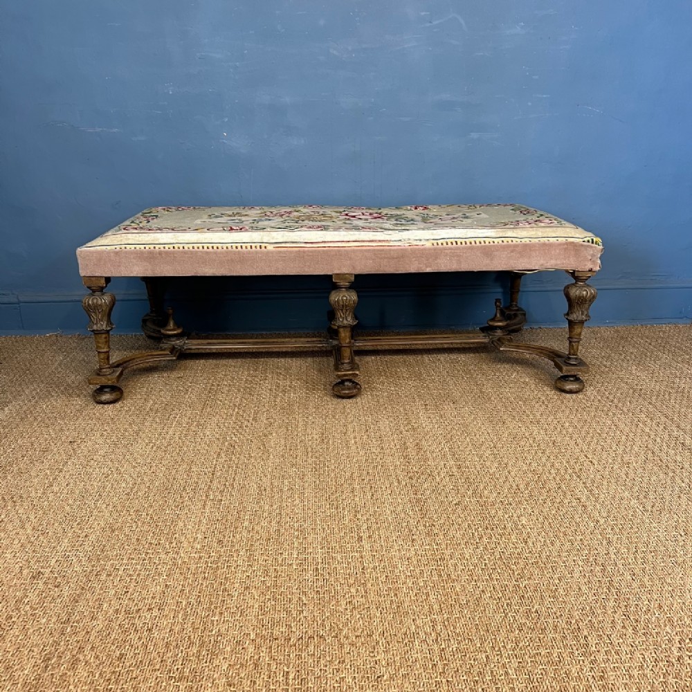 A large Edwardian carved walnut stool in William and Mary style circa 1910 .