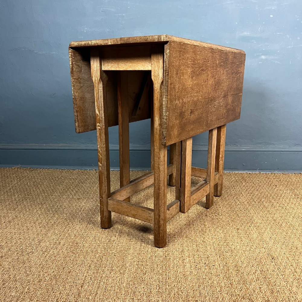 A small Cotswold School limed oak gate leg table circa 1930  .
