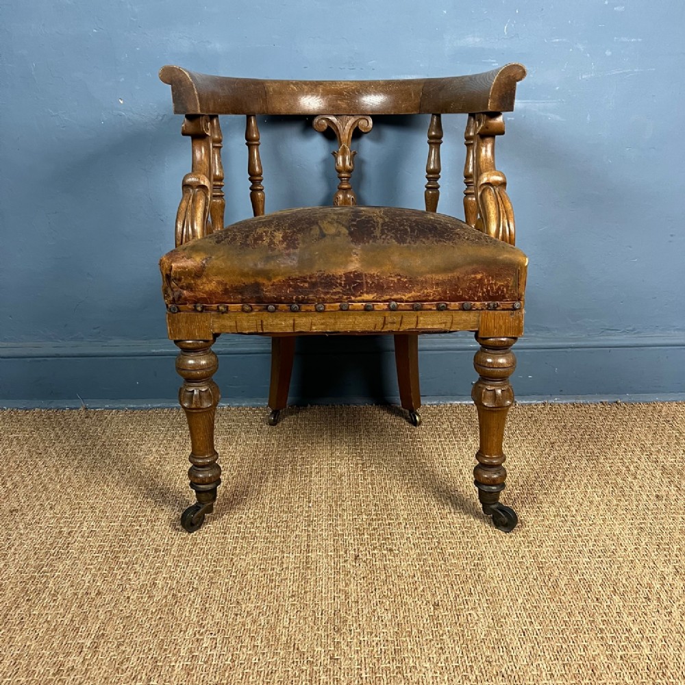 A Victorian oak desk chair circa 1860 