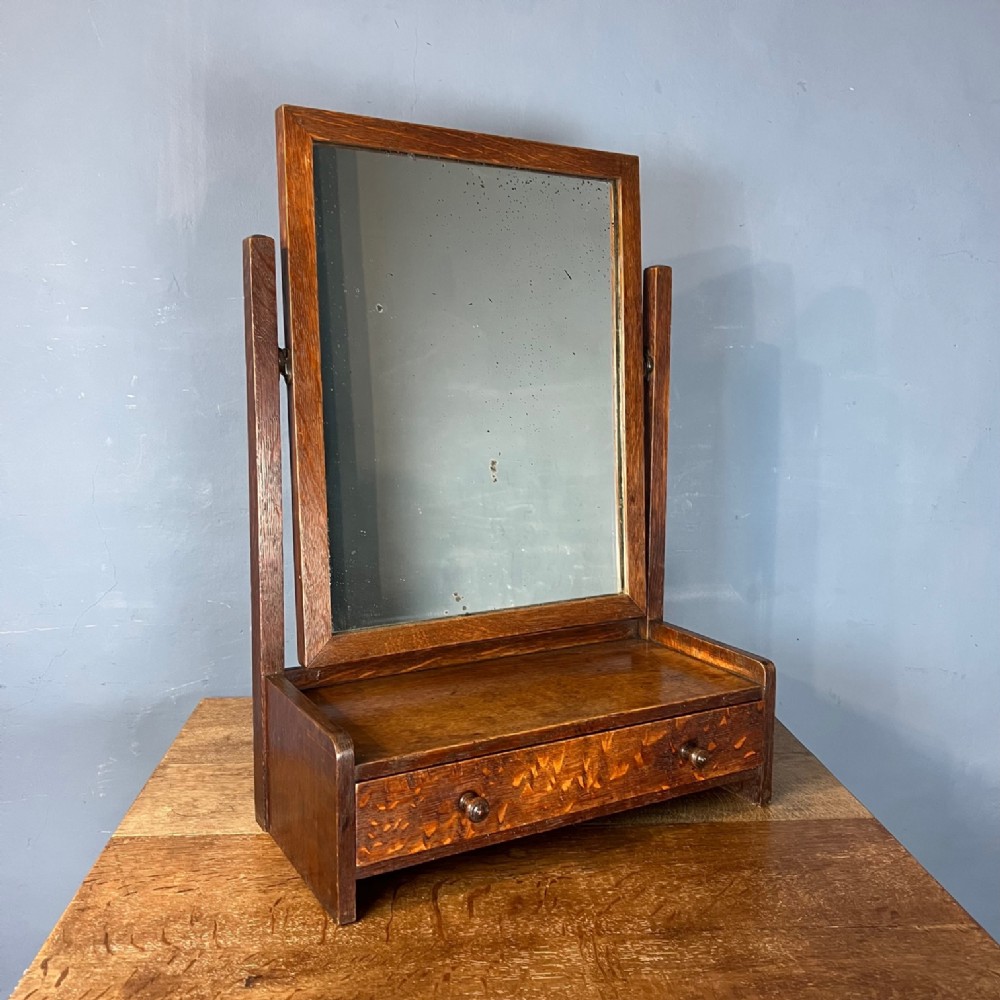 An early Heals Letchworth swing frame oak toilet mirror circa 1908