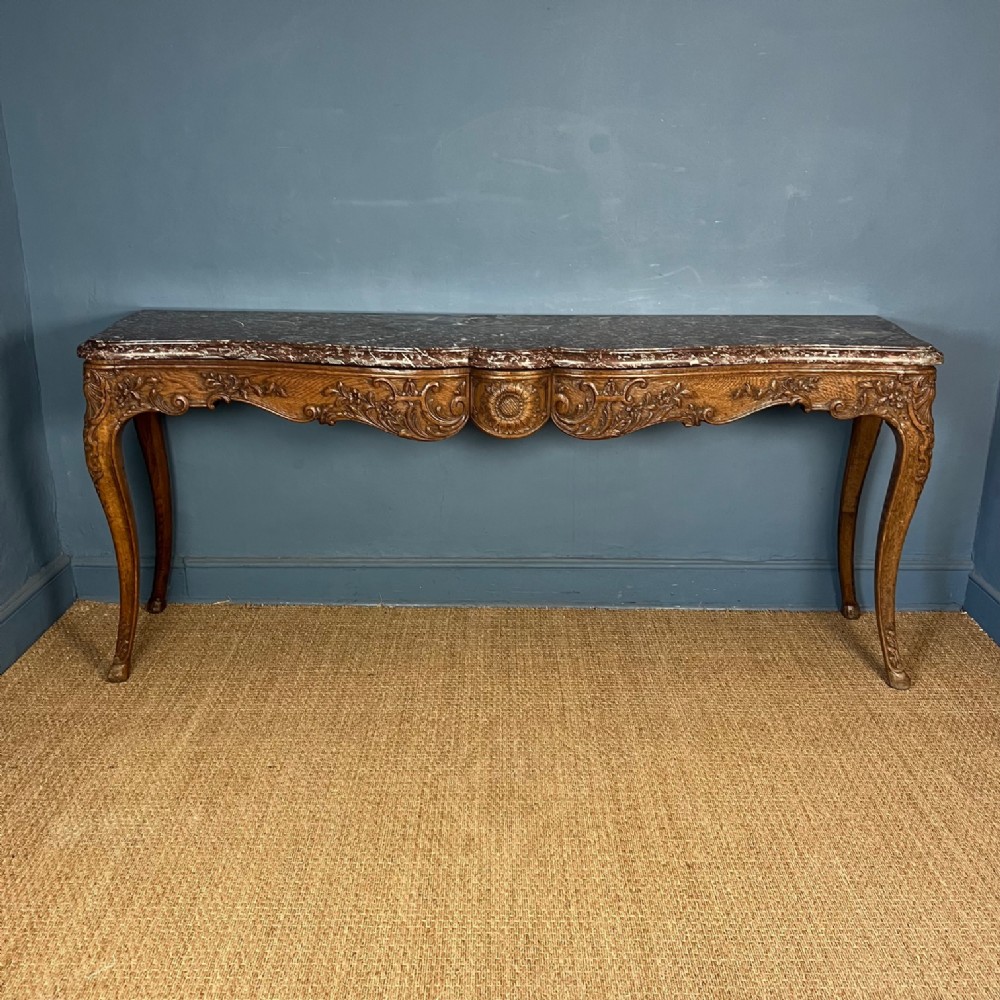 A large mid 19th c French oak console table circa 1870