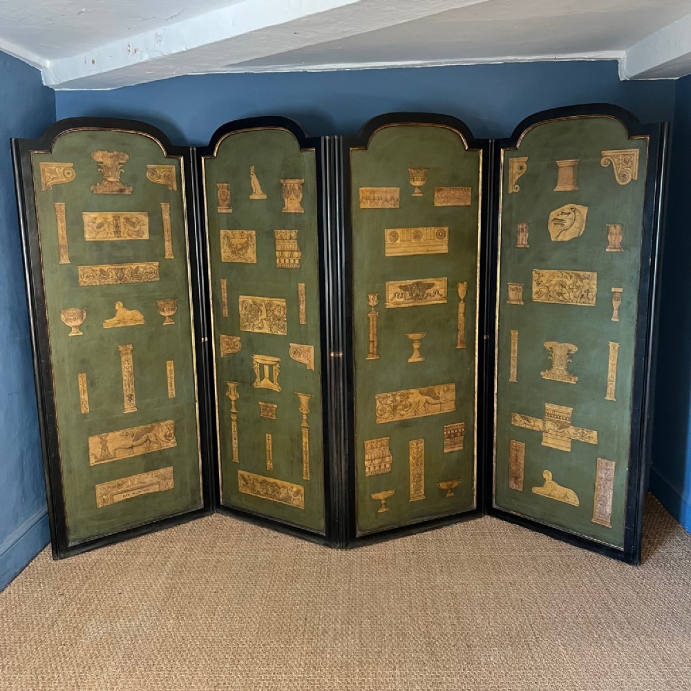 An early Victorian ebonised mahogany and parcel gilt screen c 1860 