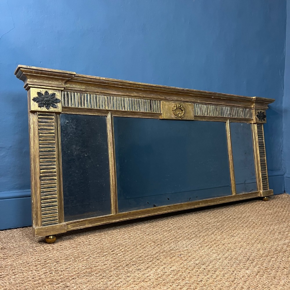 A Regency gilt and ebonised triple plate over mantel mirror circa 1820