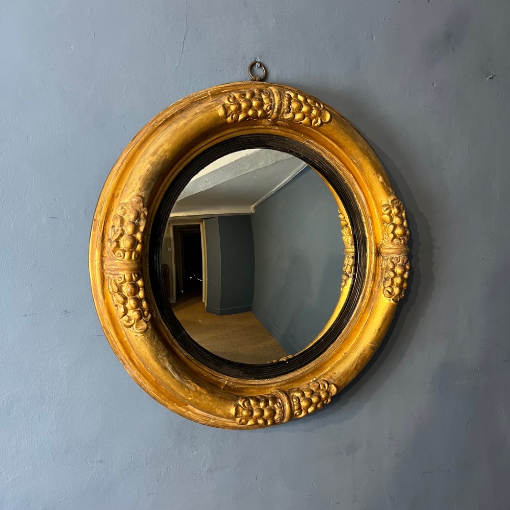 A large William IV gilt convex mirror circa 1835