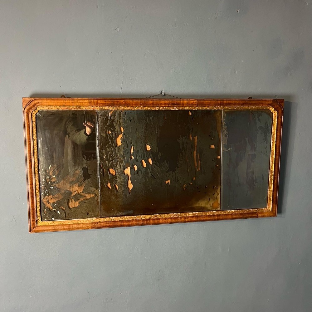 A George 11 walnut and parcel gilt over mantel mirror circa 1740
