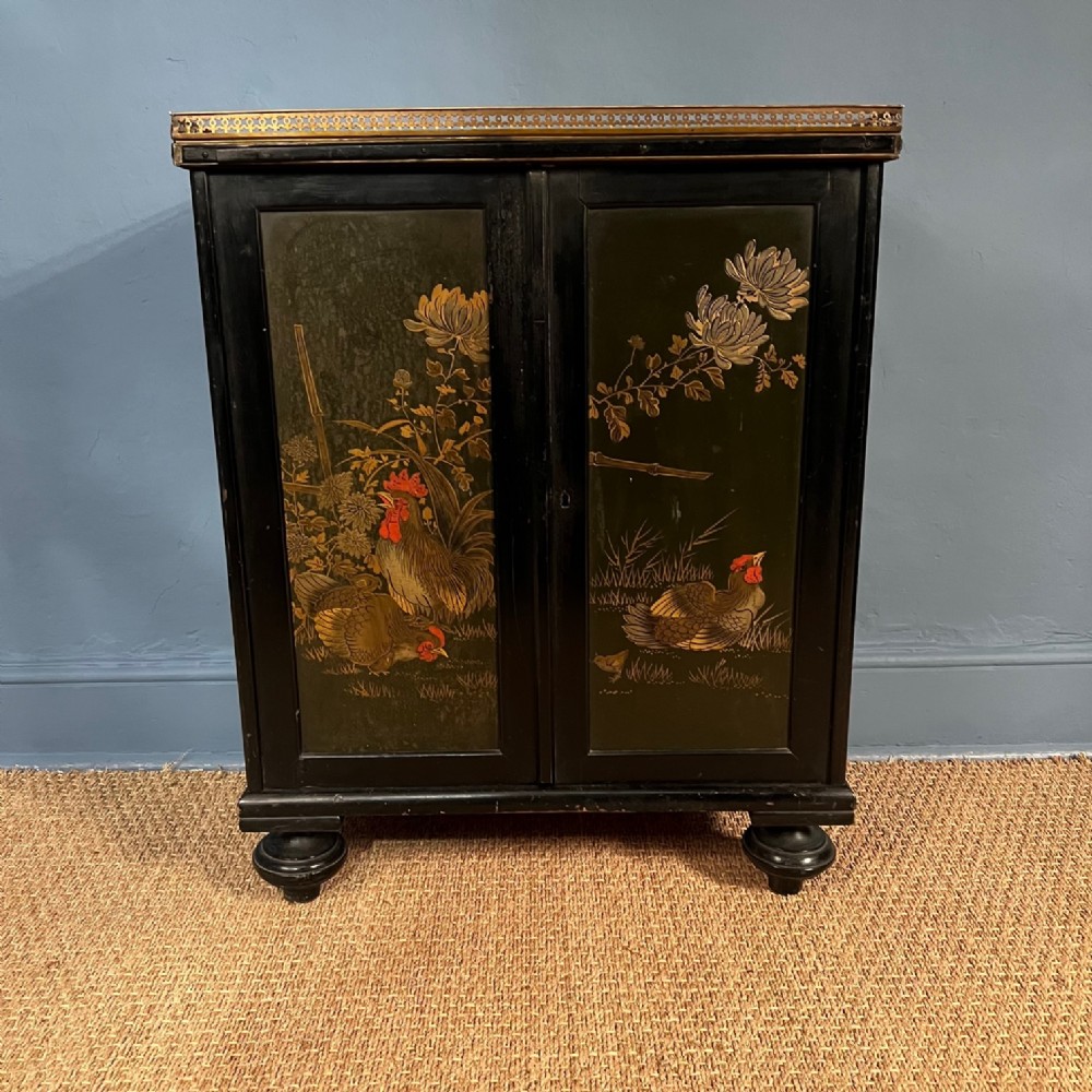 A mid 19th c chinoiserie lacquer side cabinet circa 1850