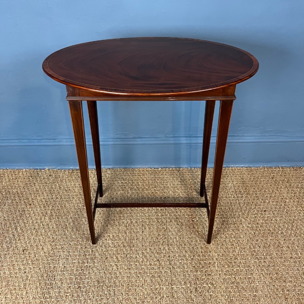 An unusual Edwardian oval mahogany and crossbanded occasional table circa 1910.