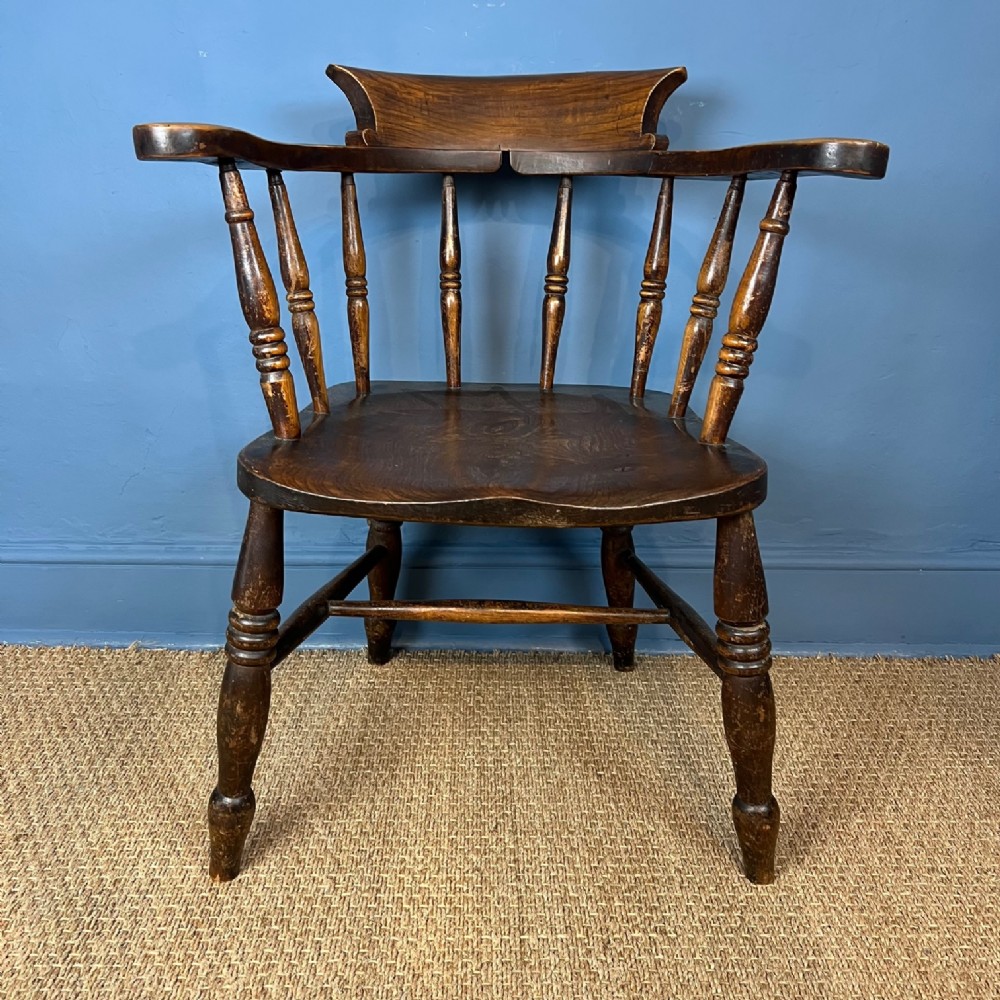 A late 19th century smokers bow armchair circa 1890