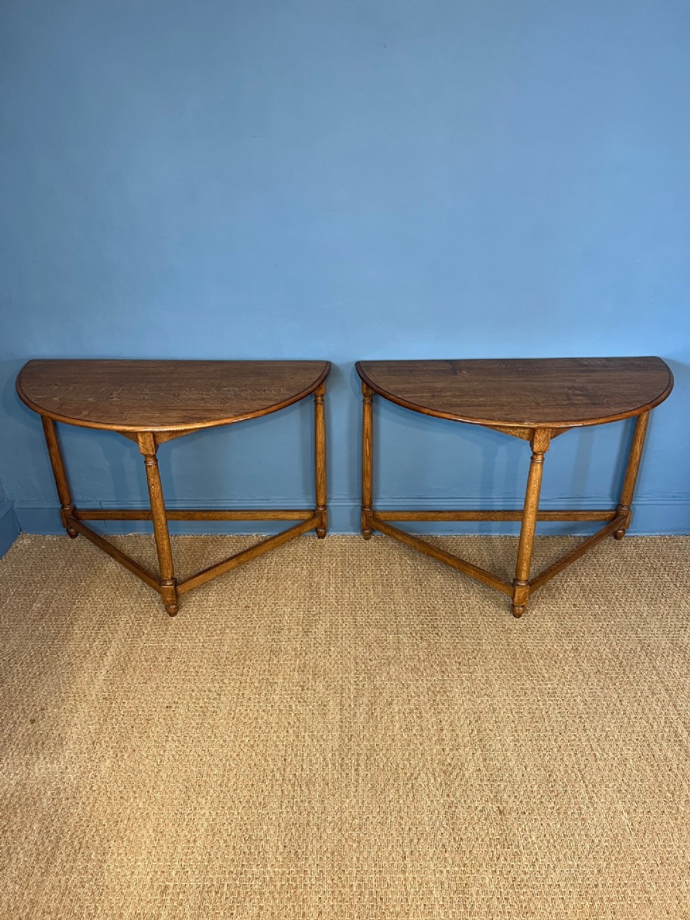 A pair of golden oak Demi-Lune side tables circa 1920, 