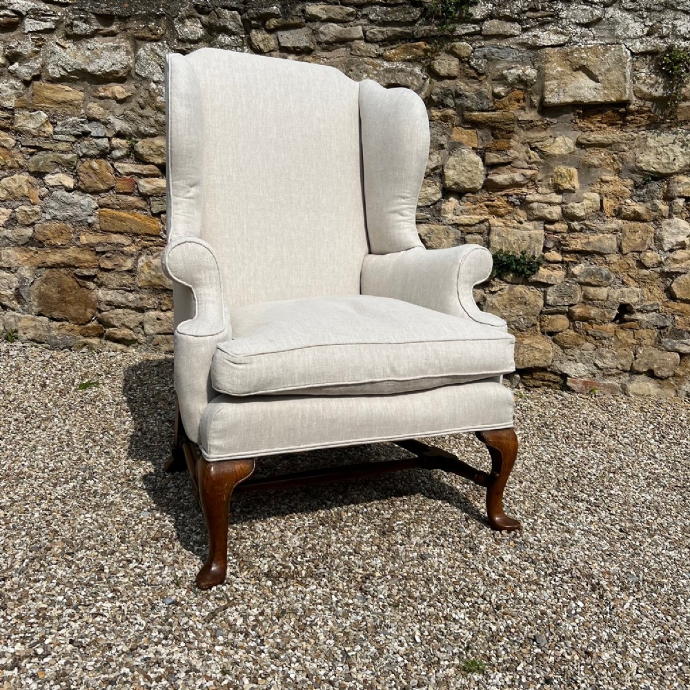 An Edwardian walnut wing arm chair circa 1910