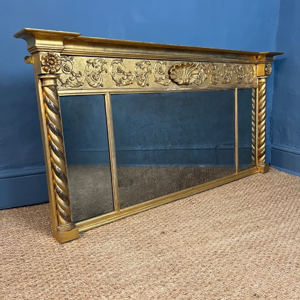A George IV giltwood triple plate overmantel mirror circa 1830