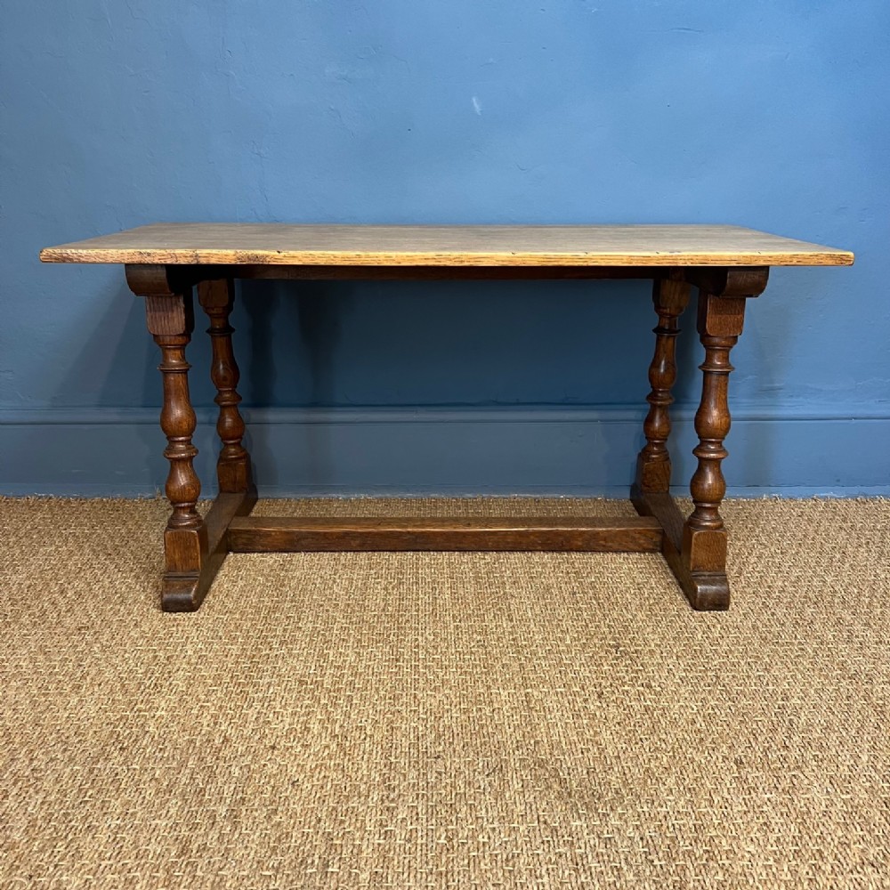 A Cotswold School oak coffee table circa 1930 