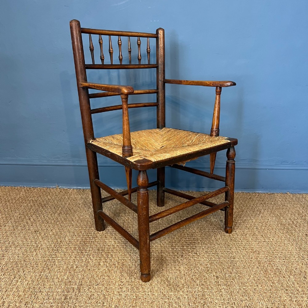 A late 19th c rush seated beech Country Armchair circa 1880 