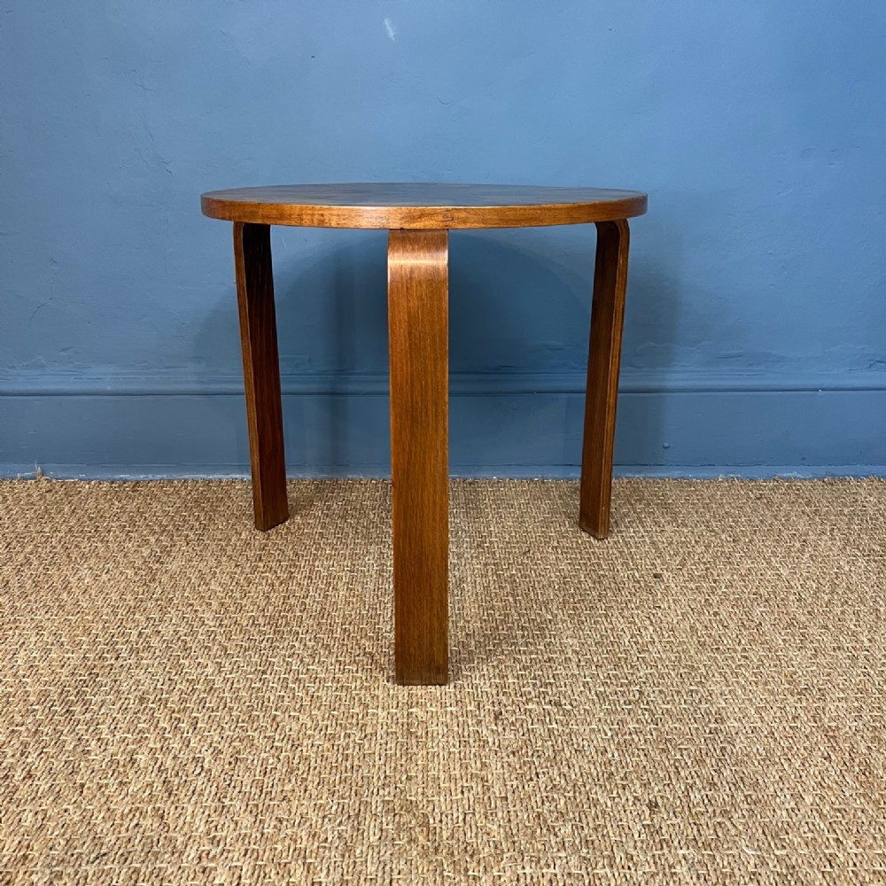 A Finmar and Co radially veneered walnut table after a design by Alva Aalto circa 1930