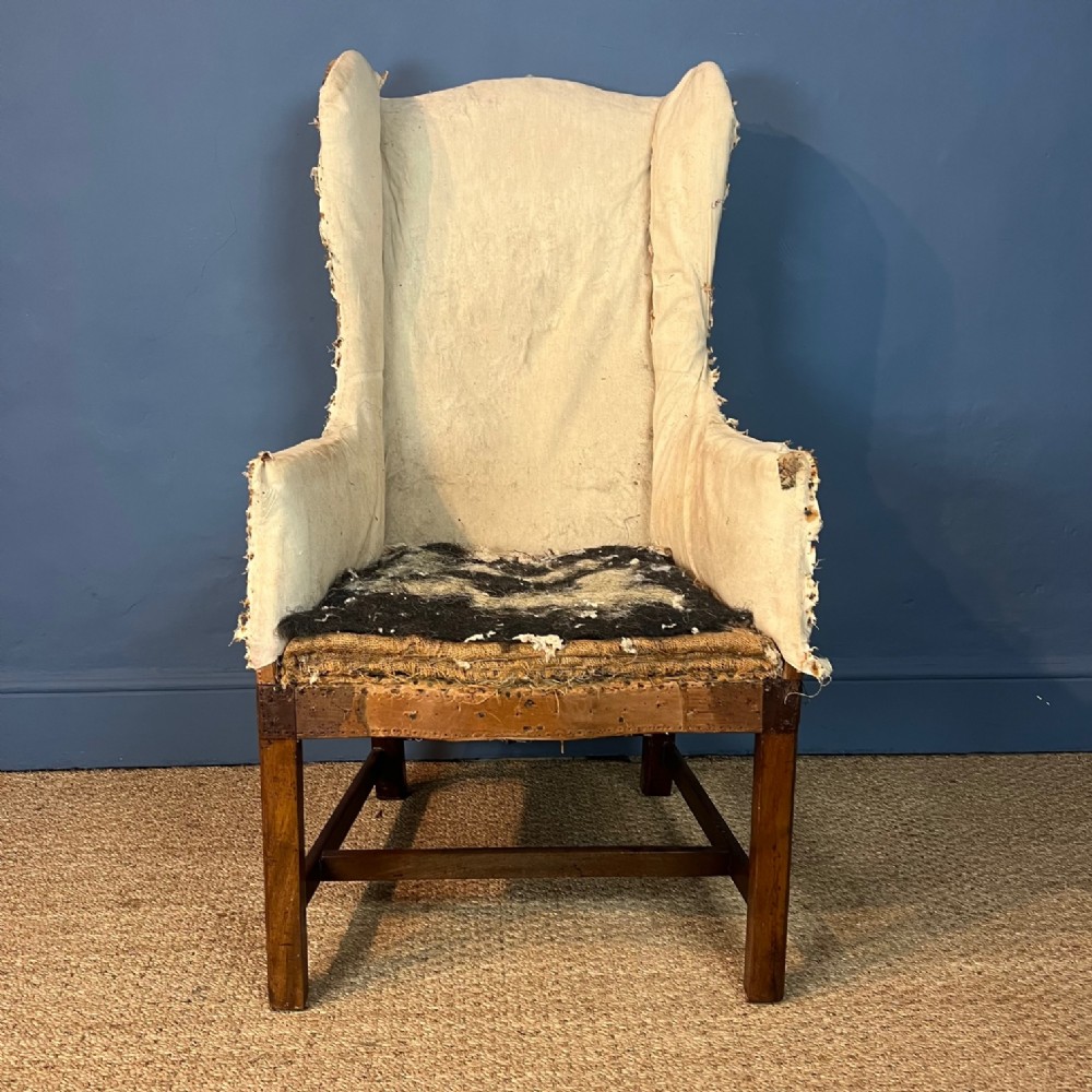 A small George 111 mahogany wing chair circa. 1800