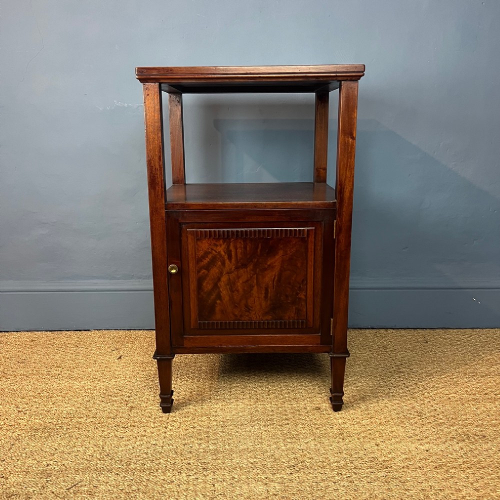 A Howard and Sons mahogany 2 tier bedside cupboard circa 1910