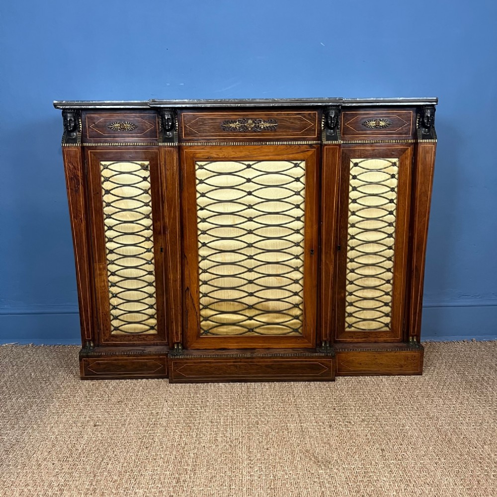 A Regency rosewood and boxwood string breakfront side cabinet circa 1805