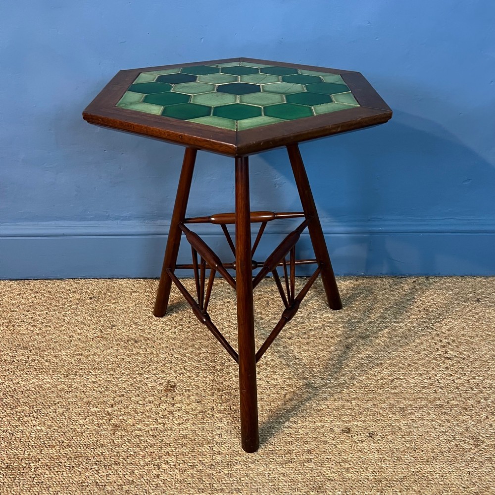 An Arts and Crafts mahogany hexagonal table circa 1900