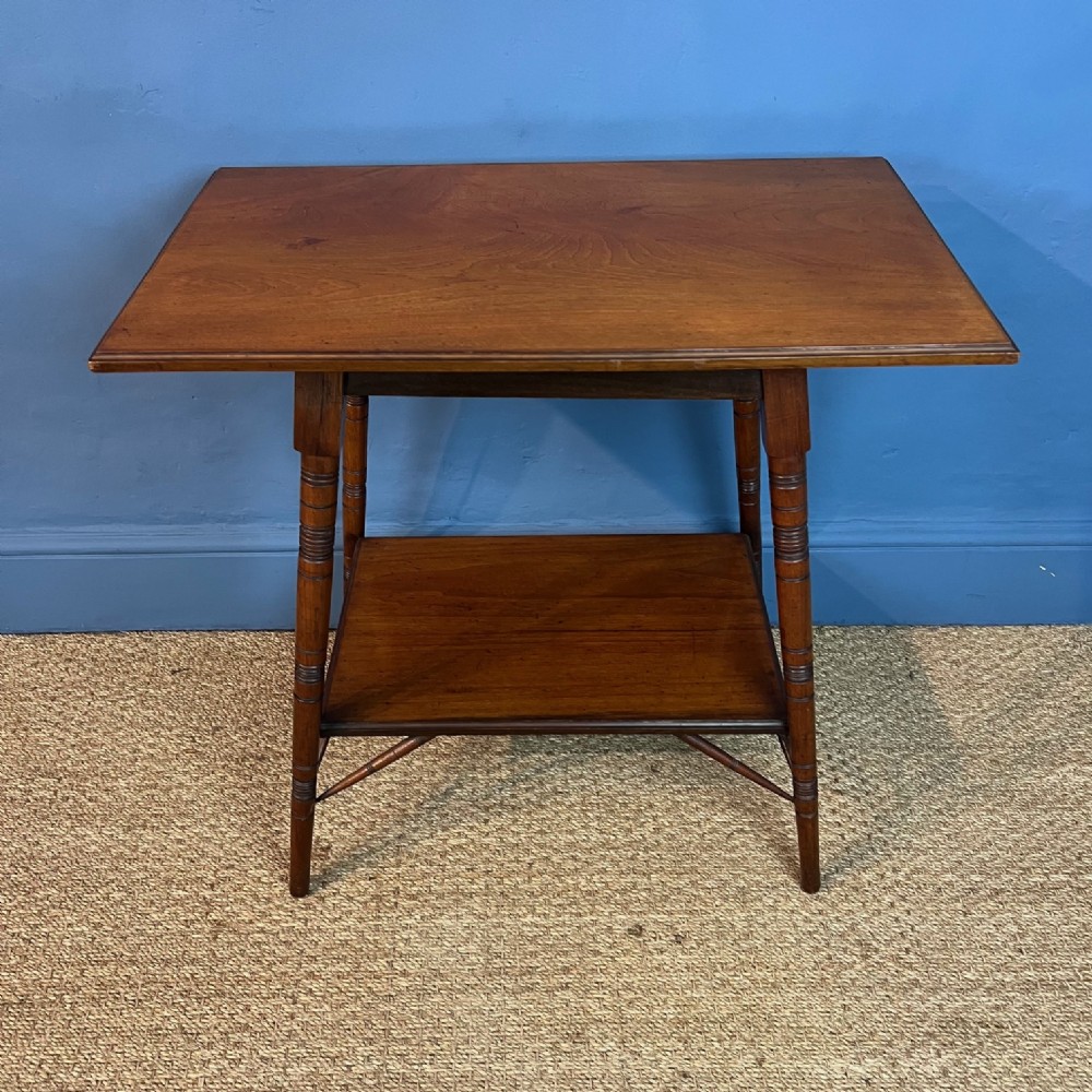 An Aesthetic Movement walnut 2 tier rectangular table circa 1880