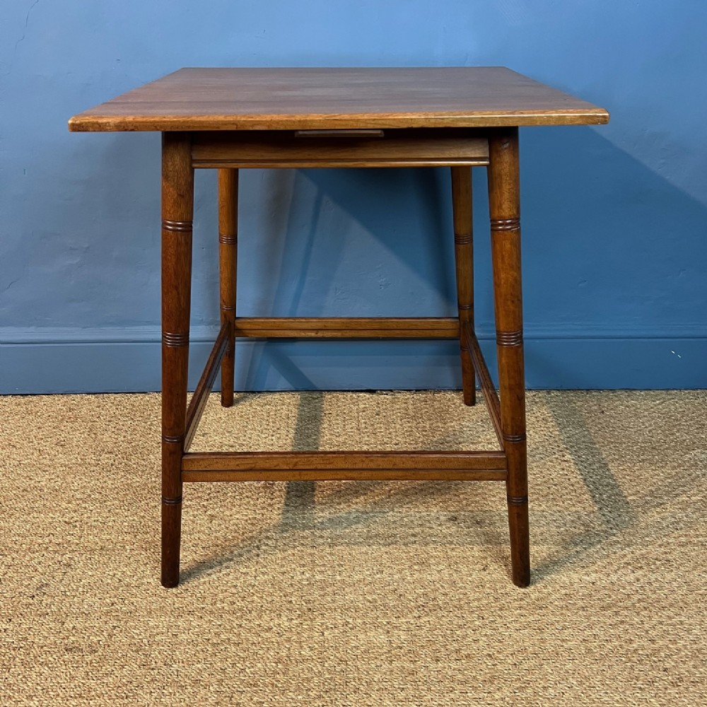 A large Aesthetic Movement walnut square table circa 1880