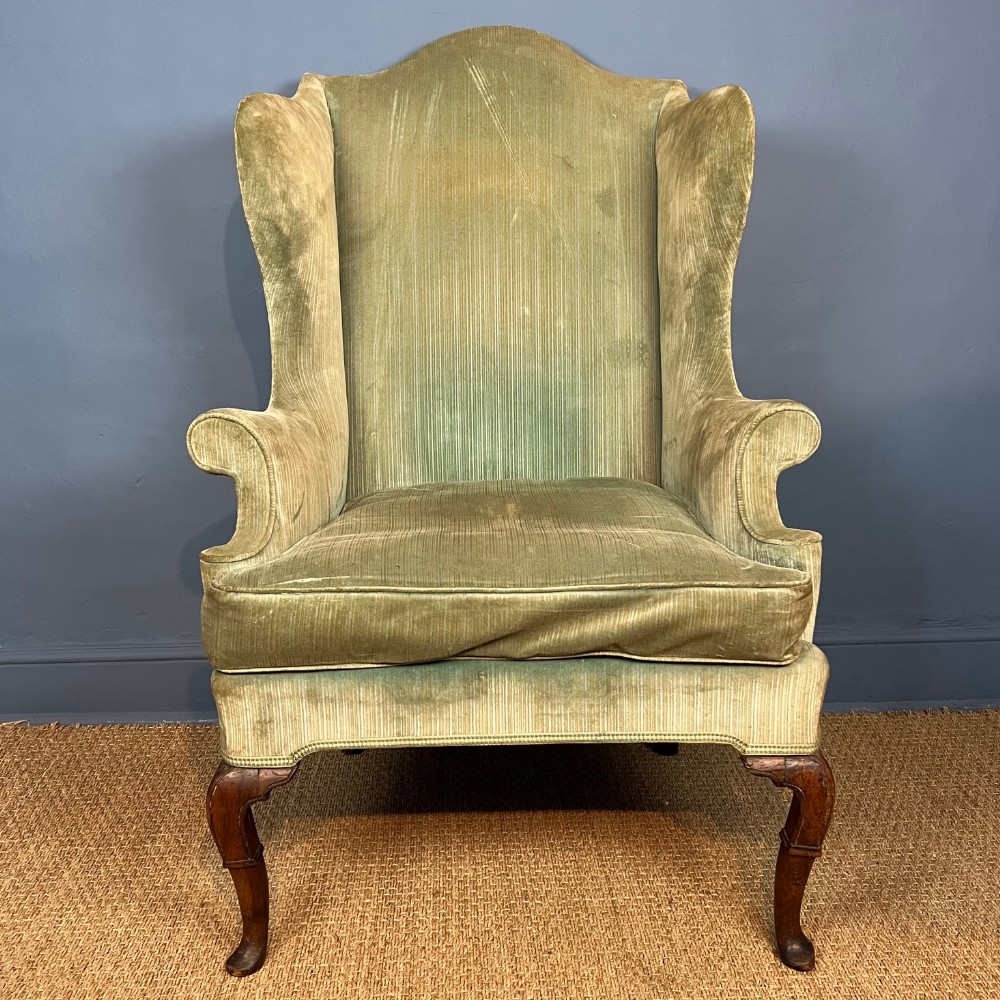 A George I walnut wing armchair circa 1720
