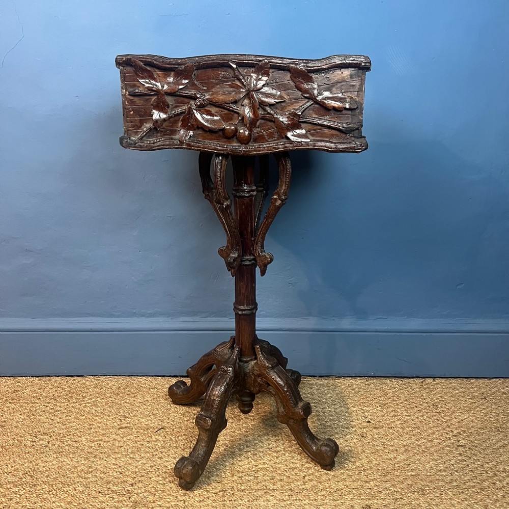 A late 19th Century carved wood Naturalistic planter, probably Black Forest circa 1890