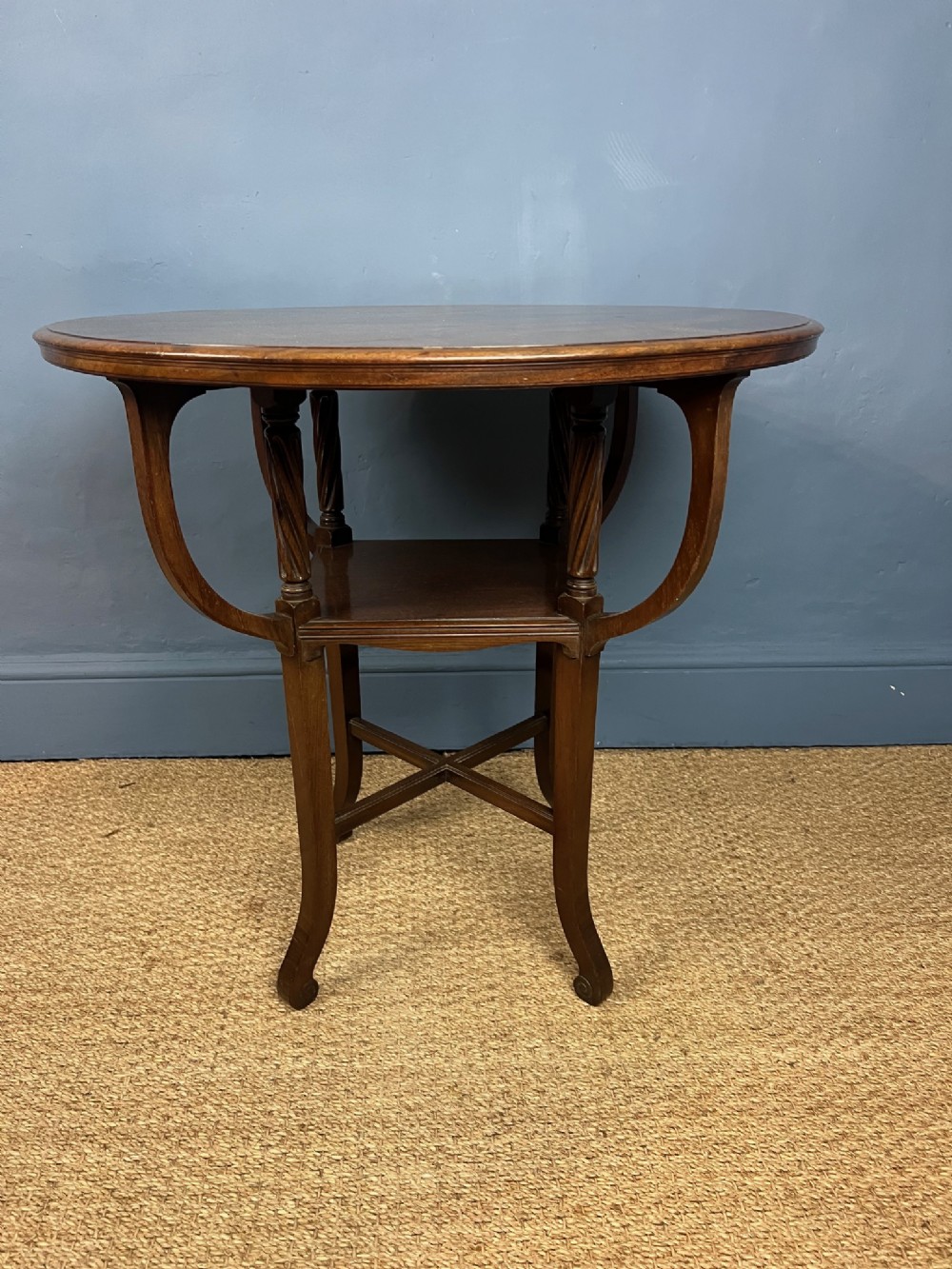 An unusual Arts and Crafts circular mahogany table, circa 1890 