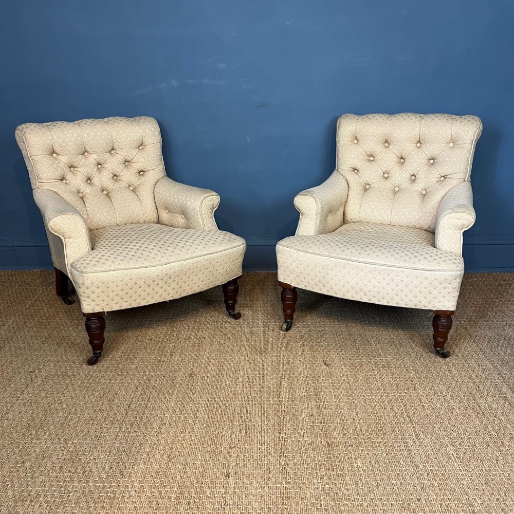 A pair of Victorian walnut button back armchairs circa 1880