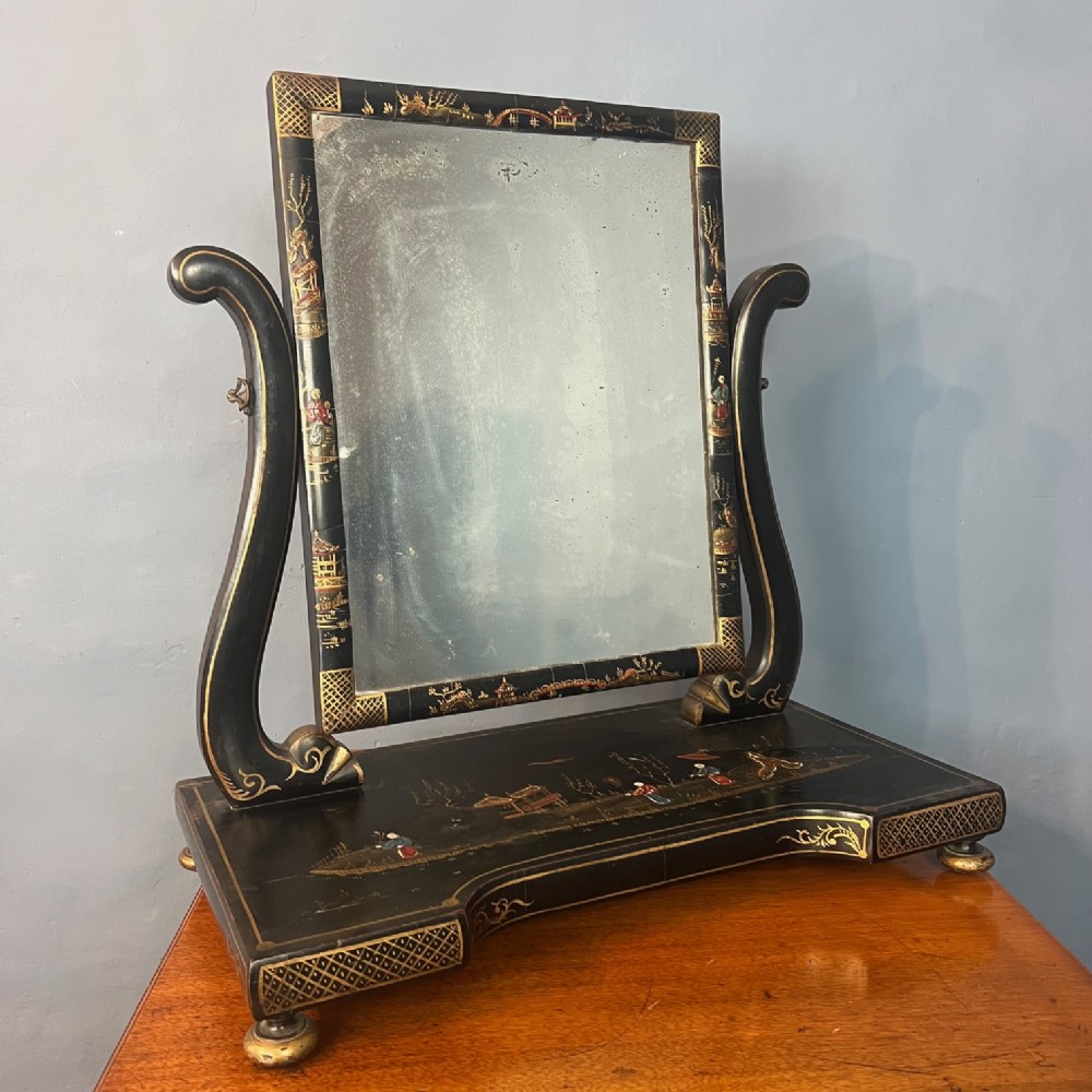 A late 19th C Chinoiserie lacquer swing frame toilet mirror