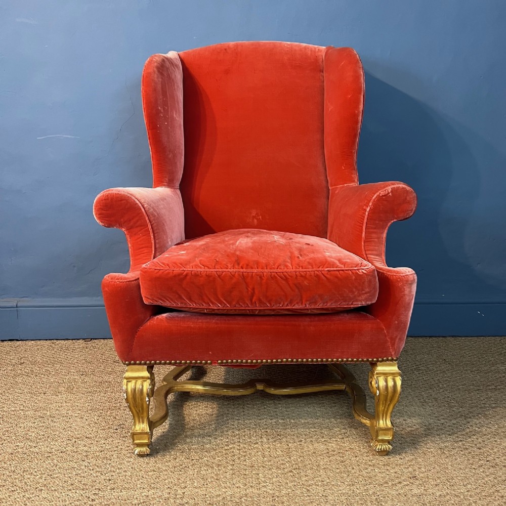 A Queen Anne style giltwood wing armchair circa 1910 