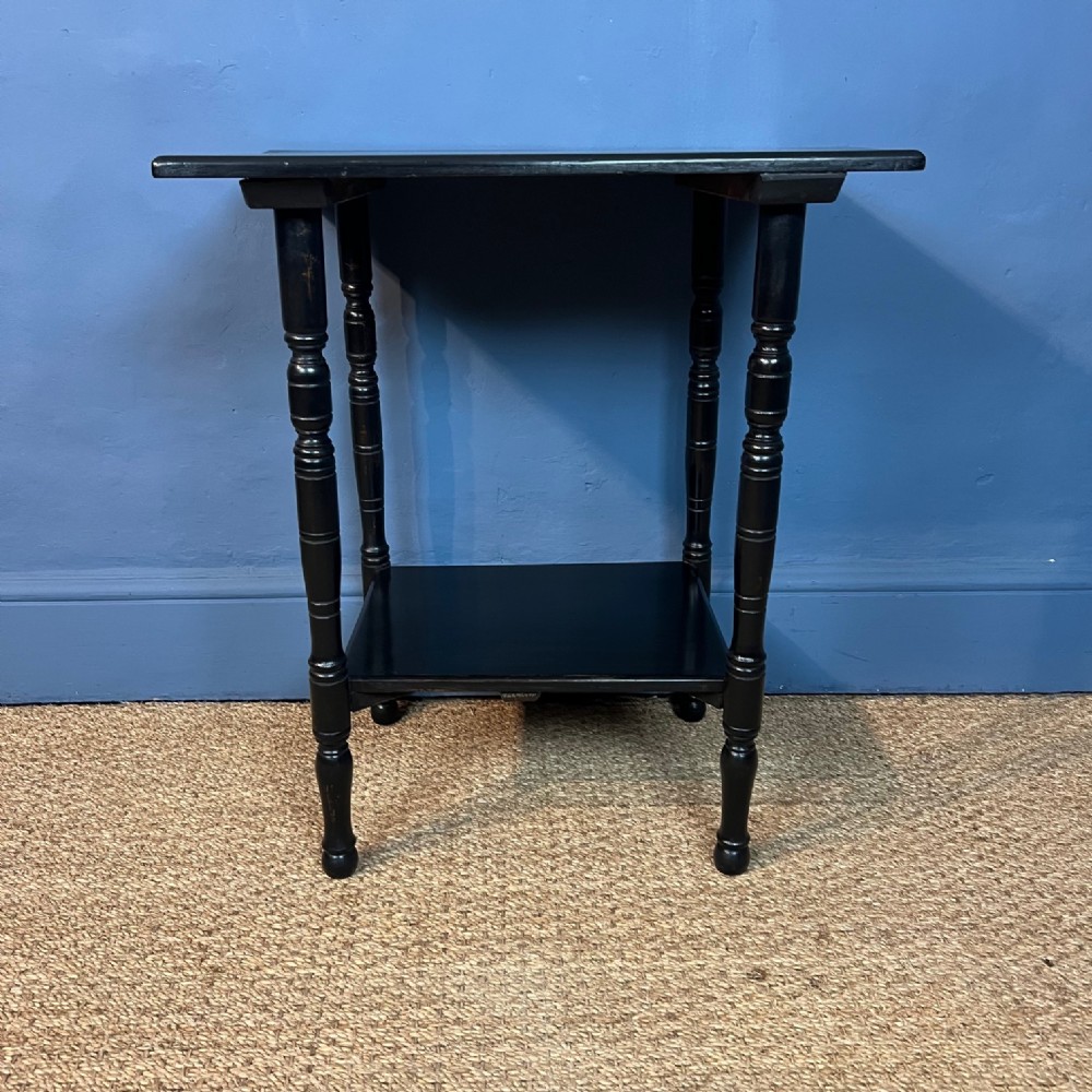 An Aesthetic Movement ebonised 2 tier table circa 1890