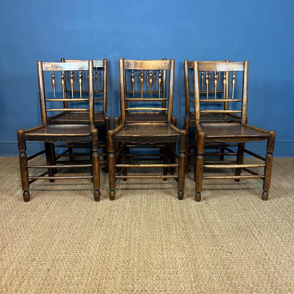 A set of six mid 19th century Cheshire ash and elm ladderback chairs